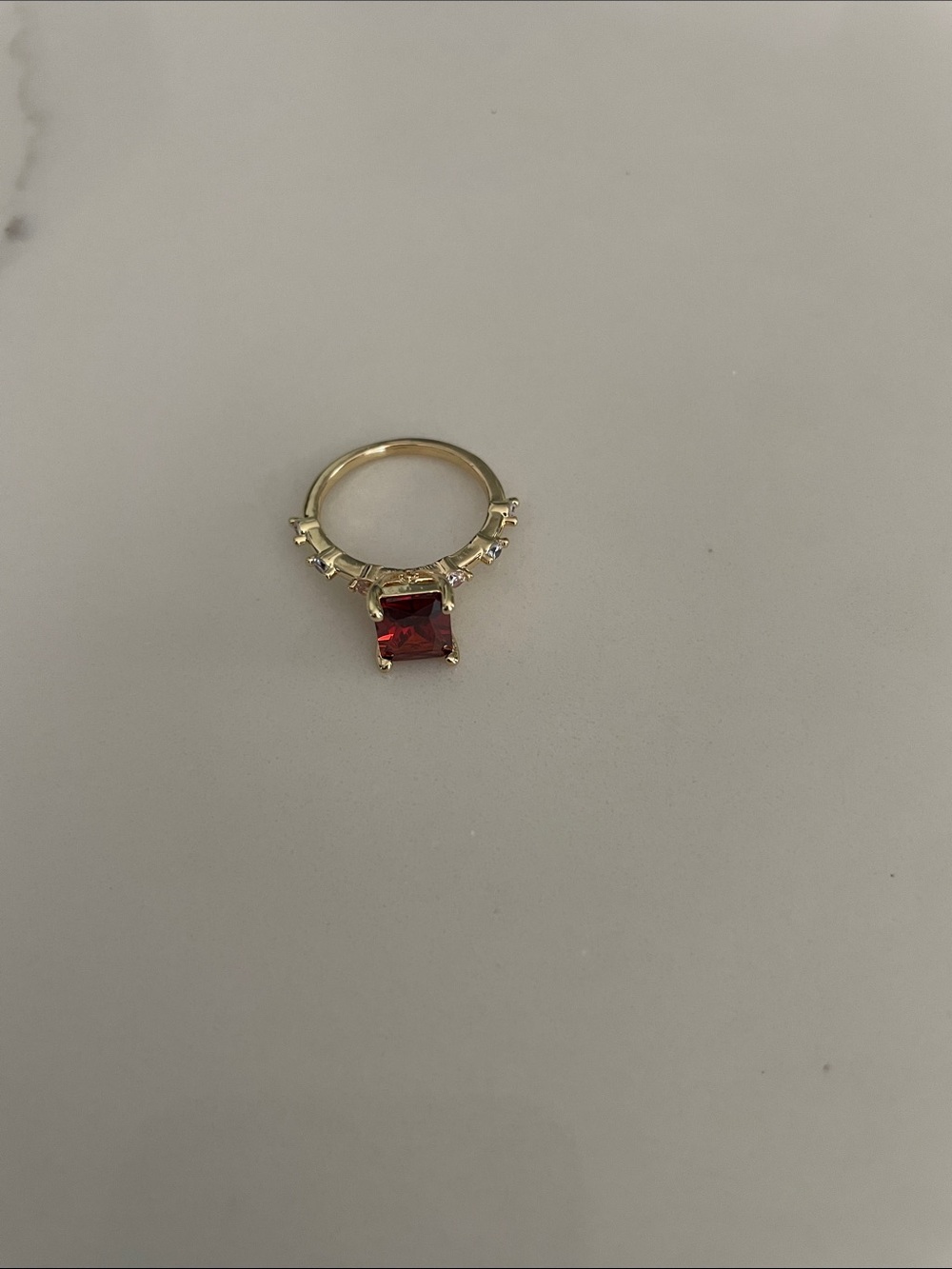 Gold tone Ring with Square red / orange colored center  and Accent Stones